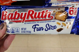 hand holding a pack of baby ruth fun size bars