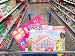 2 Create a Treat Barbie Cookie Dreamhouse Kits in a Walmart shopping cart