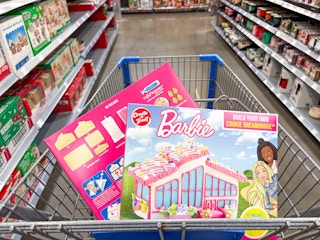 2 Create a Treat Barbie Cookie Dreamhouse Kits in a Walmart shopping cart