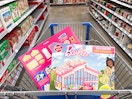 2 Create a Treat Barbie Cookie Dreamhouse Kits in a Walmart shopping cart