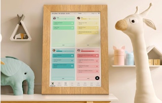 a wooden frame digital wall calendar on a table in a nursery 