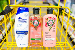 herbal essences and head and shoulders hair care in a yellow shopping cart