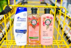 herbal essences and head and shoulders hair care in a yellow shopping cart
