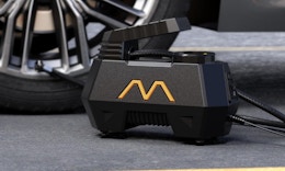 a tire inflator next to a tire