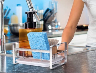 silver kitchen sponge holder on a sink
