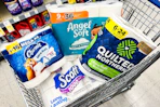 scott, charmin, quilted northern, and angel soft products in a shopping cart