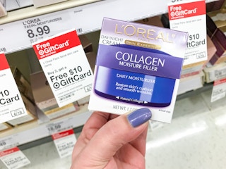 hand holding l'oreal collagen filler cream in front of promotion target tag