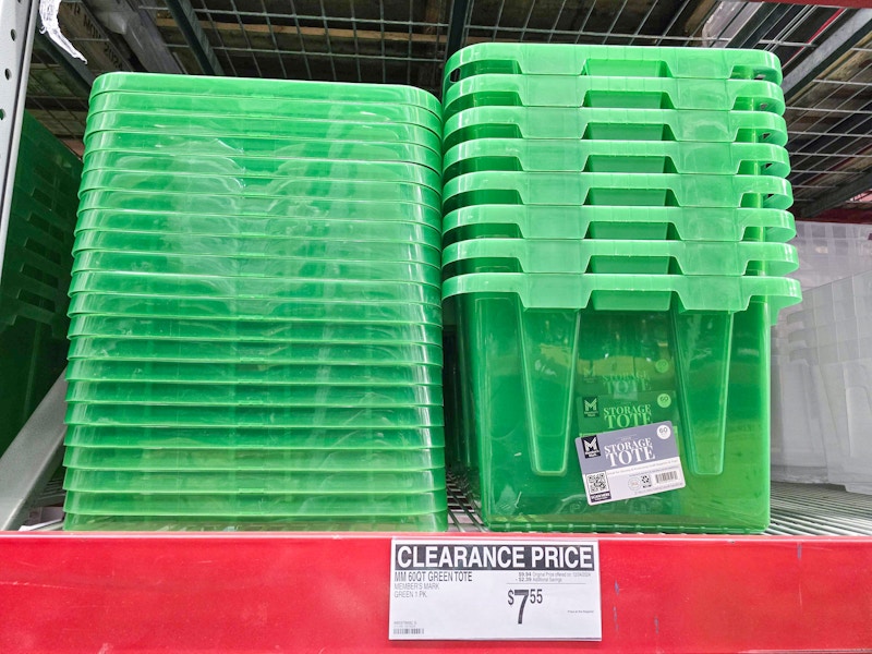 large green heavy duty storage totes on a shelf