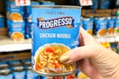 hand holding a can of progresso soup