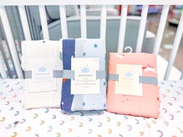 cloud island bedding sitting in a crib at target