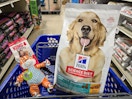 bag of hills science diet dog food and a kong dog toy in a cart