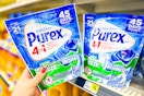 hand grabbing a bag of purex laundry pacs
