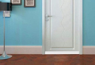 door draft stopper on white door in a room