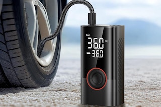 a tire inflator and air compressor connected to a tire