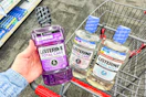 hand holding a bottle of listerine mouthwash