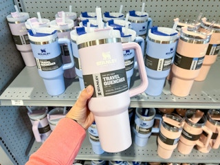 hand holding Stanly cup at Dick's on shelf