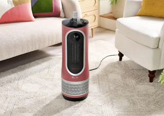 a pink air purifier in a living room