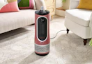 a pink air purifier in a living room