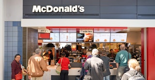 mcdonalds senior discount patrons in line ordering food at airport restaurant feature