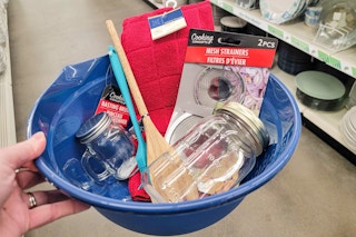 hand holding a bowl with items to make sourdough
