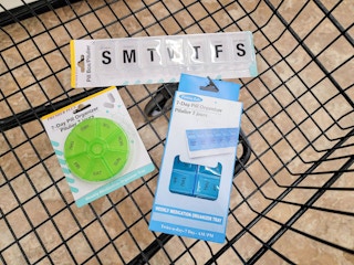 pill organizers in a cart