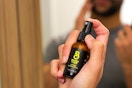 a man using the beard club beard riptide spray