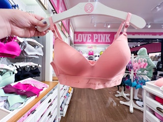 someone holding a wear everywhere bra from pink