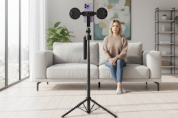 a woman facing a tripod
