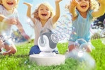 children playing with bubble machine outside