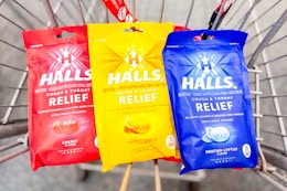 3 bags of halls cough drops in a cart