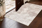 Lifestyle image of area rug in front of door