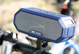 blue and gray wireless speaker mounted on a bike