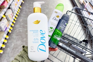 hand holding dove body wash and deodorant sprays