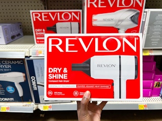hand holding revlon crystal tourmaline hair dryer at walmart