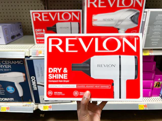 hand holding revlon crystal tourmaline hair dryer at walmart