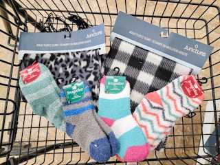 scarves and fuzzy socks in a cart