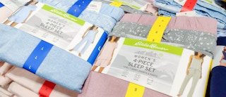 pajamas stacked up on a table at costco