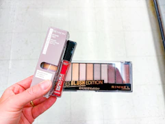 hand holding walgreens beauty clearance items