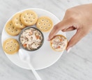 tuna salad spread on a plate with crackers