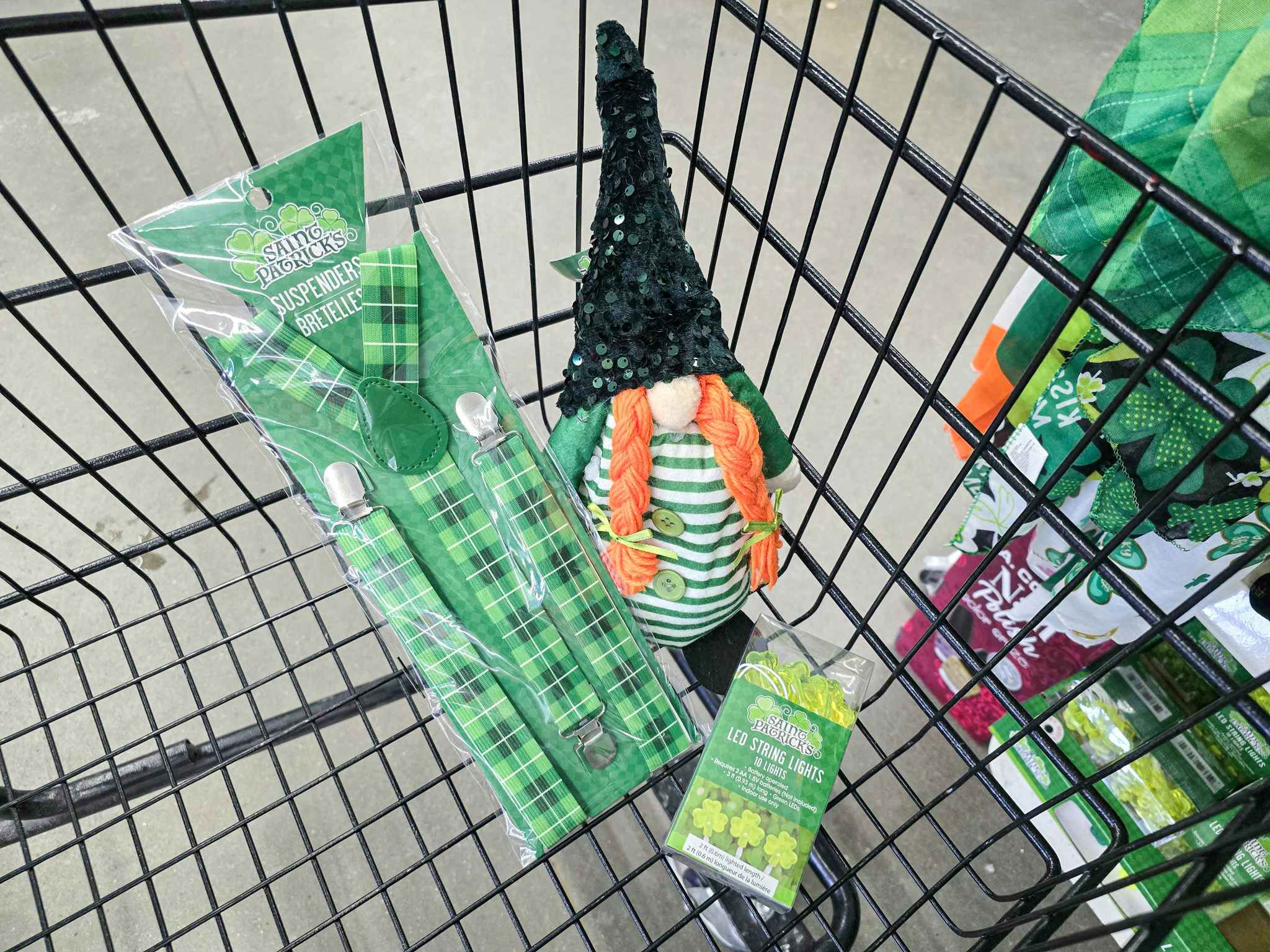 saint patricks day suspenders, a gnome, and string lights in a cart