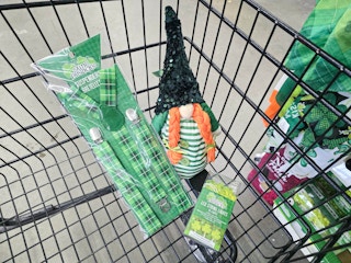 saint patricks day suspenders, a gnome, and string lights in a cart