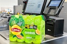 a package of lipton ice tea with uber eats code sittig at a walmart self checkout 