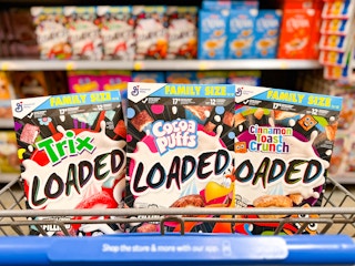 Twix, Cocoa Puffs, and Cinnamon Toast Crunch Loaded cereal in a Walmart cart