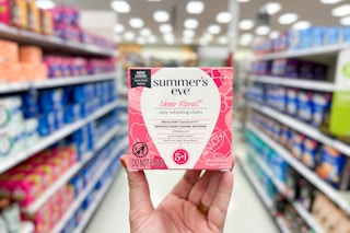 hand holding pack of wipes in store aisle