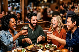 A group of people enjoy drinks and food at Applebees