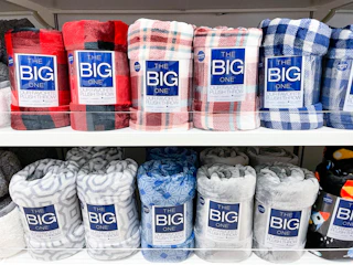 the big one plush throw on shelf