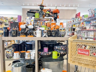 home goods halloween decor in store on shelves with cart near