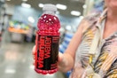 hand holding a bottle of vitaminwater