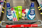 crest mouthwash, kiss nail files, garnier shampoo, degree deodorant, and old spice deodorant in a cart