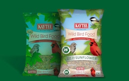 bags of bird seed on a green background